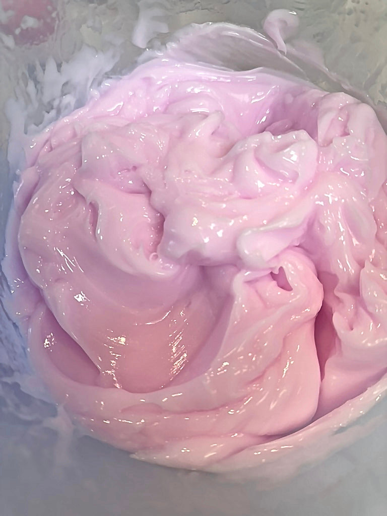 Pink swirled cream texture of Luscious Boosting Water Cream