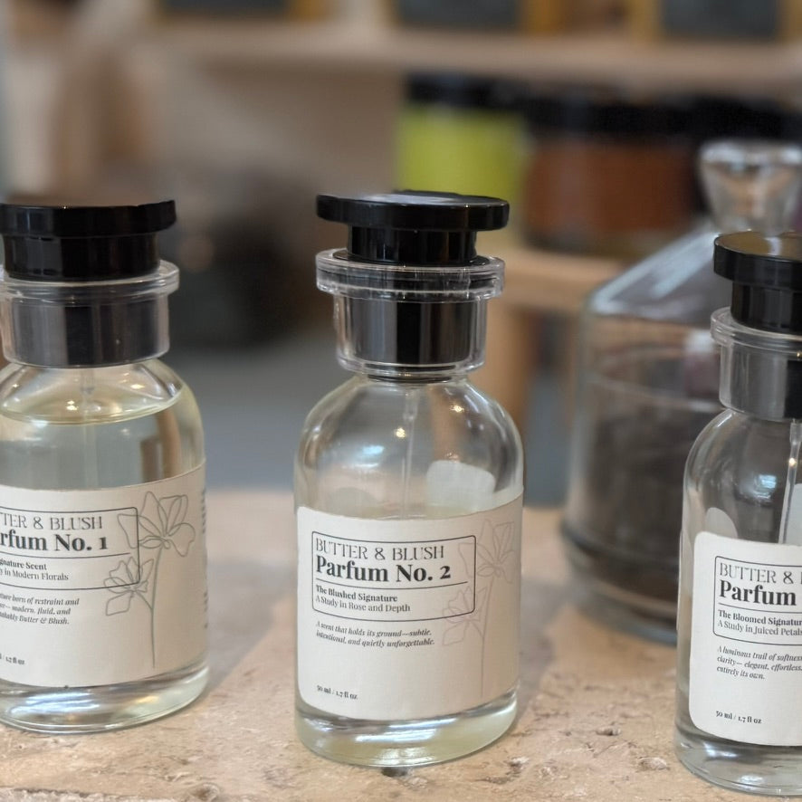 Three parfum bottles displayed together