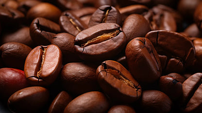 Roasted coffee beans piled in close-up, rich brown and glossy