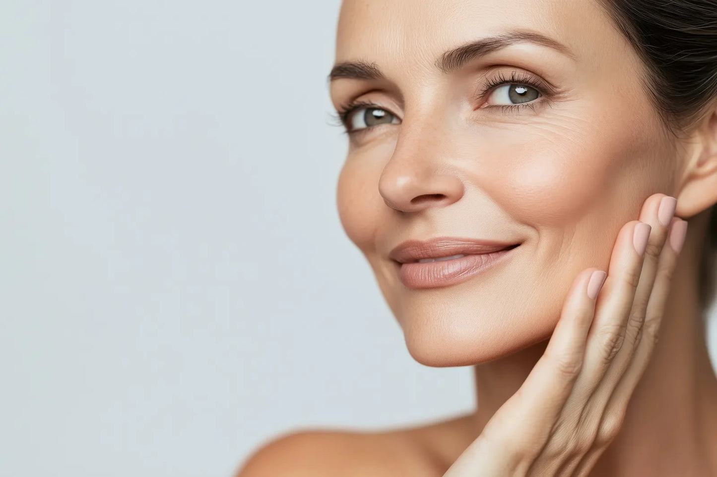 Model resting a hand against her calm, hydrated-looking skin, the Sea Lavender Revive Jelly Mask ritual